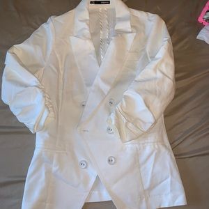 Maurice’s white blazer